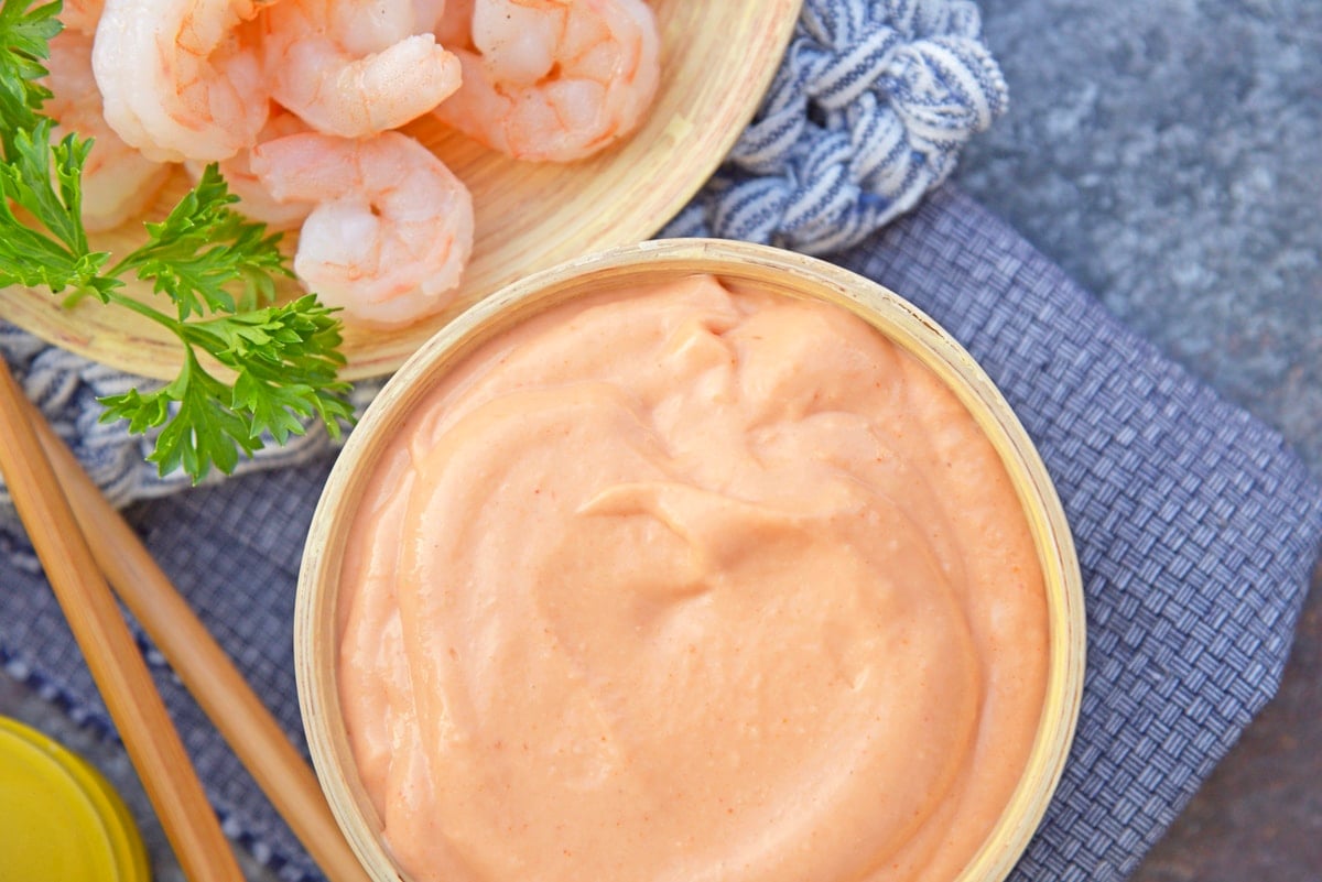 overhead shot of bowl of yum yum sauce and bowl of shrimp