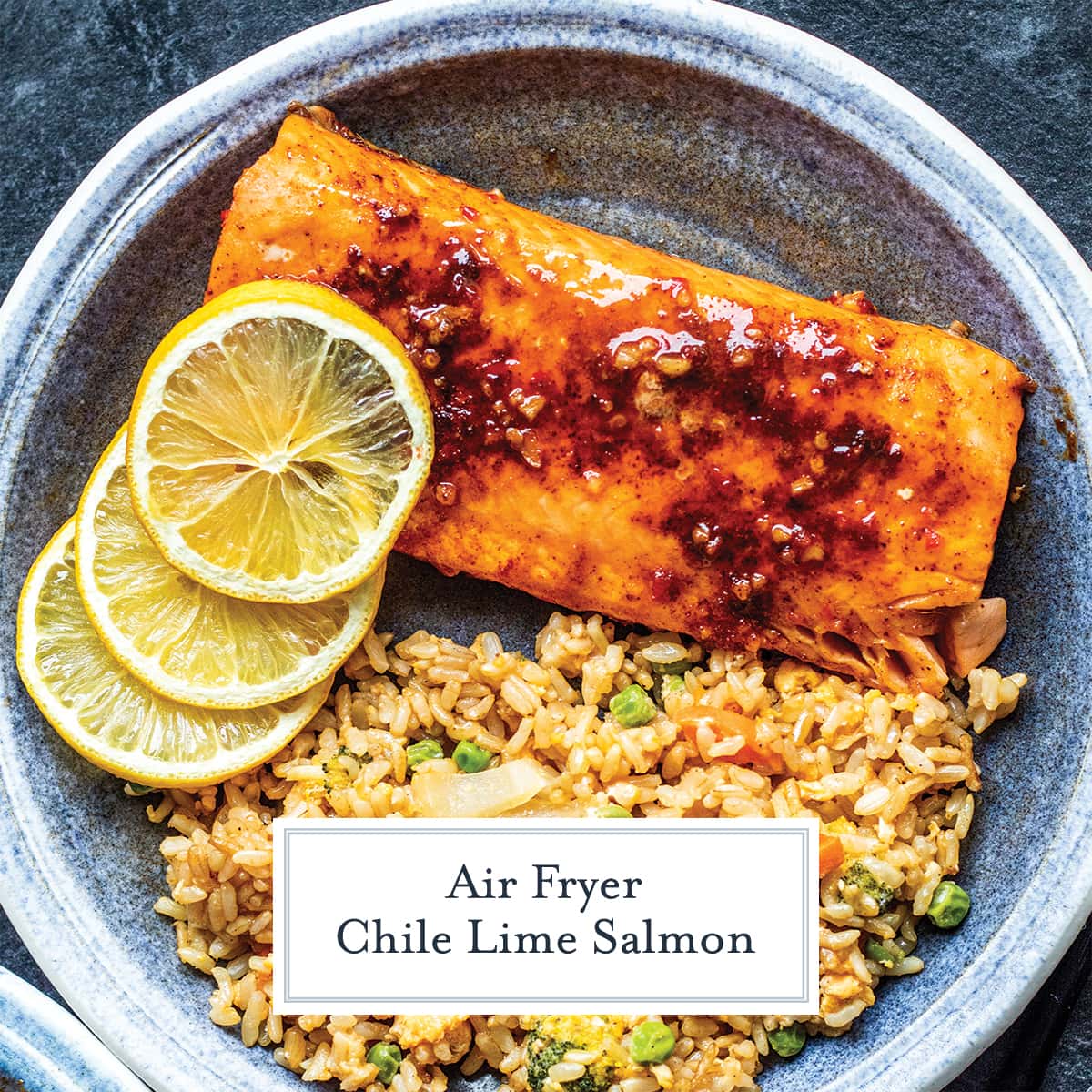 overhead of salmon filet with rice and lemon slices