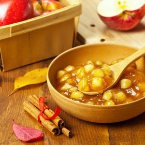 bowl of apple pie filling with cinnamon sticks