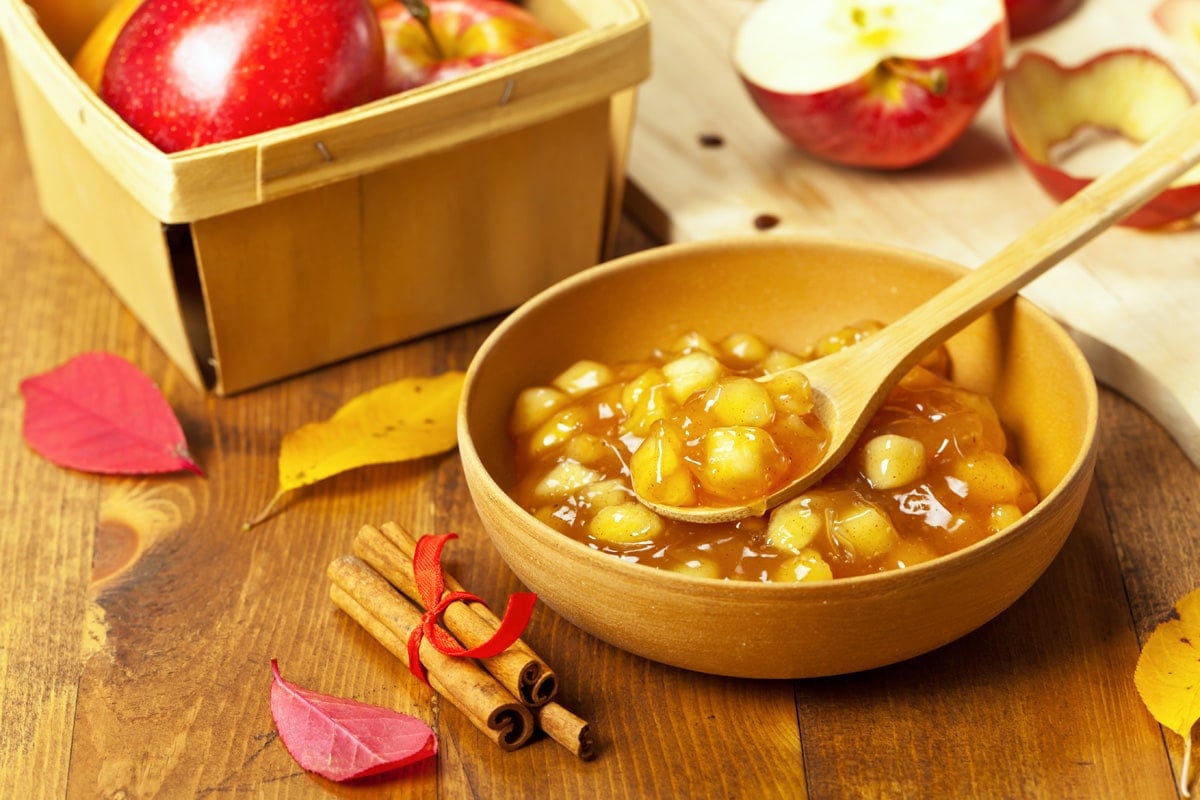 bowl of apple pie filling with cinnamon sticks