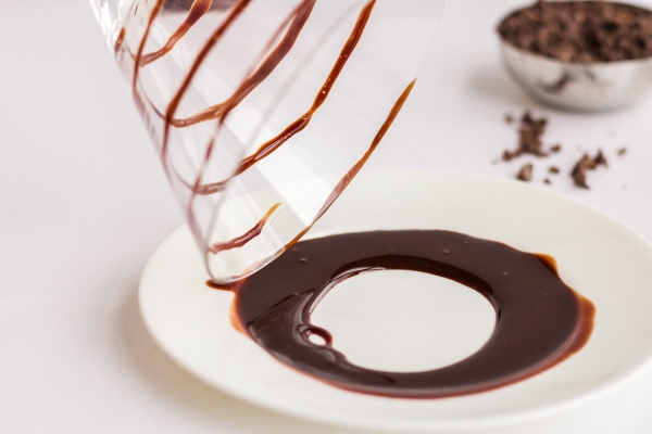 rimming glass with chocolate syrup