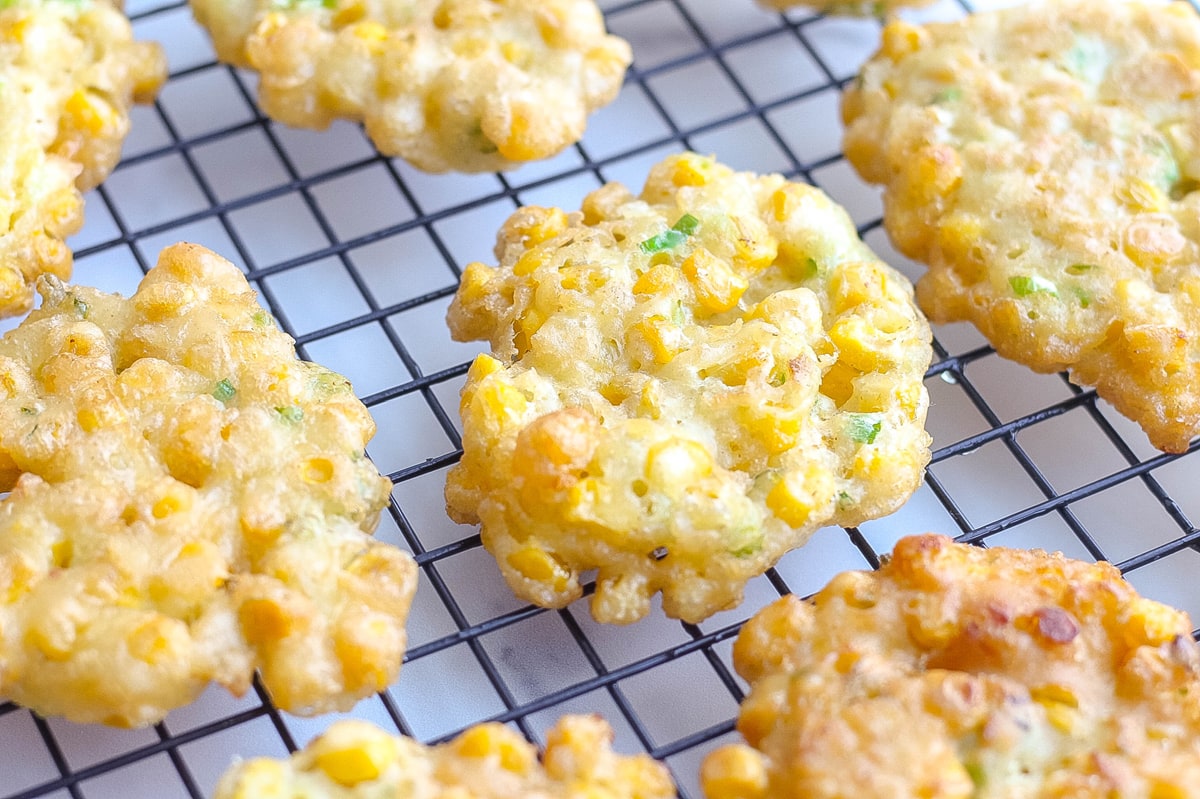 corn fritter cooling on a wire rack  