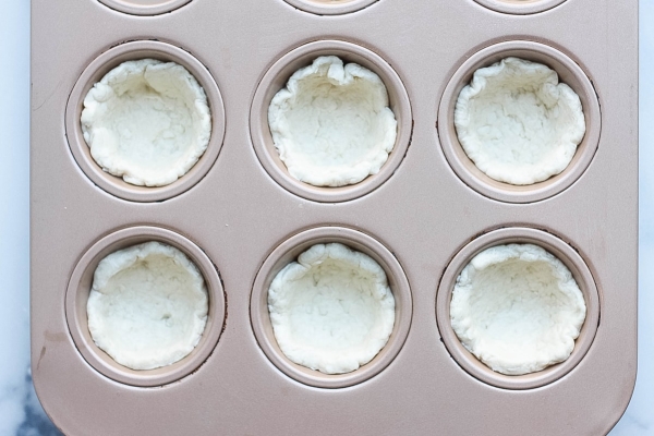 biscuit dough in a muffin tin