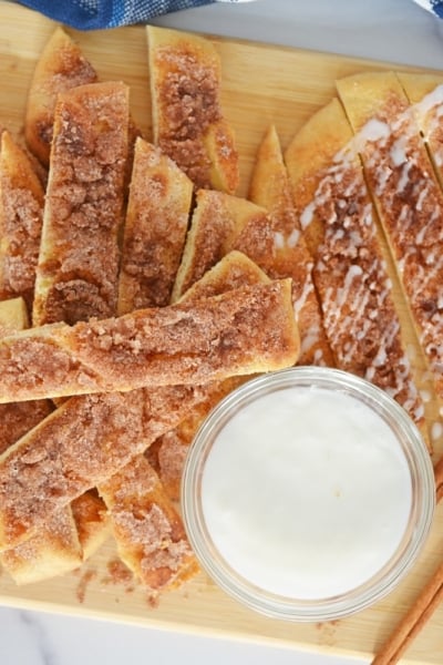 serving platter of cinna sticks with dipping sauce