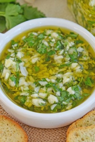 close up of garlic relish in a shallow white bowl