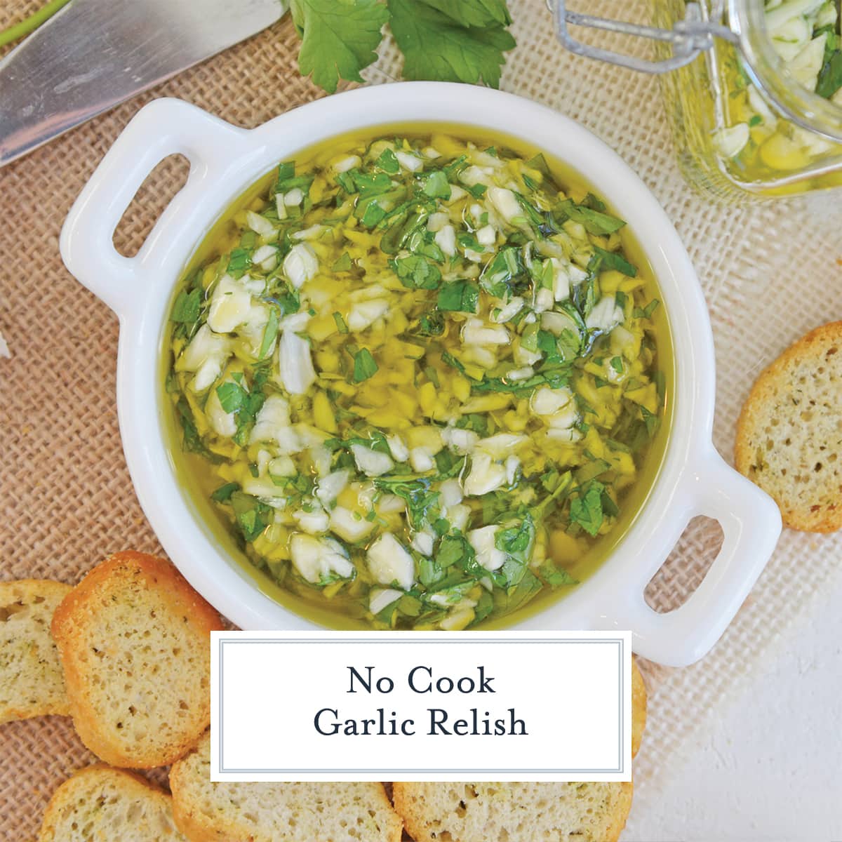 overhead of garlic relish in a shallow white bowl with crostini 