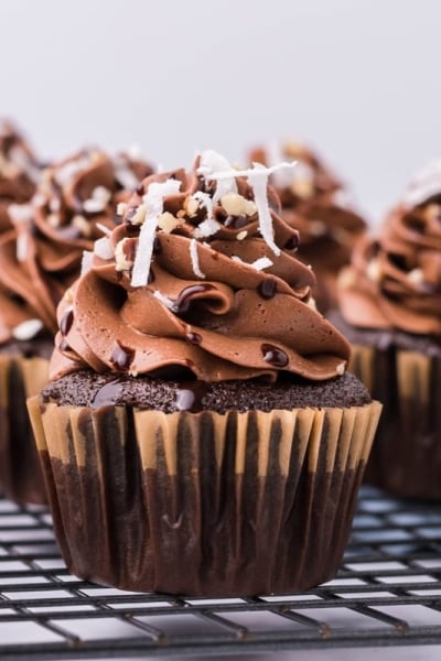 german chocolate cupcakes on a cooling rack