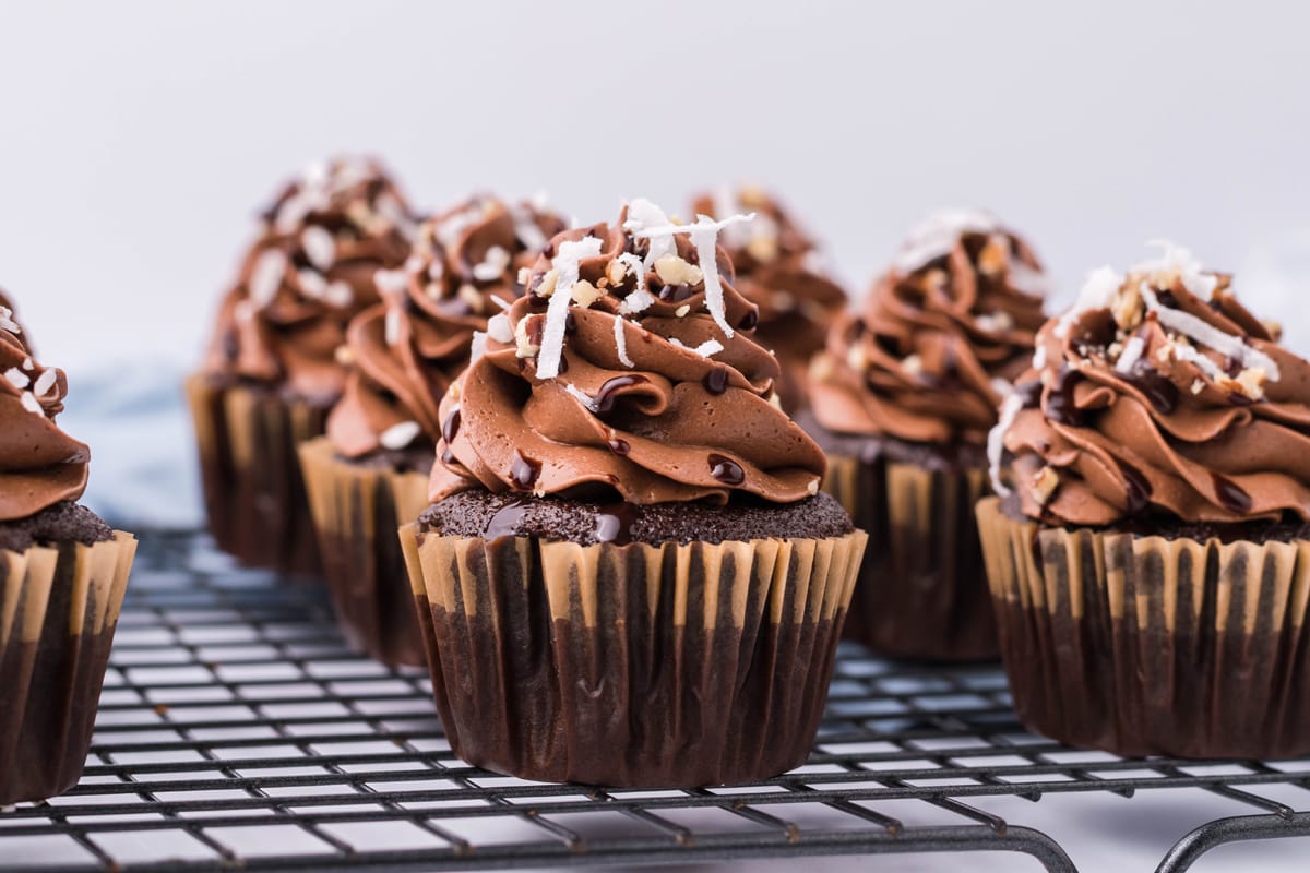 german chocolate cupcakes on a cooling rack  