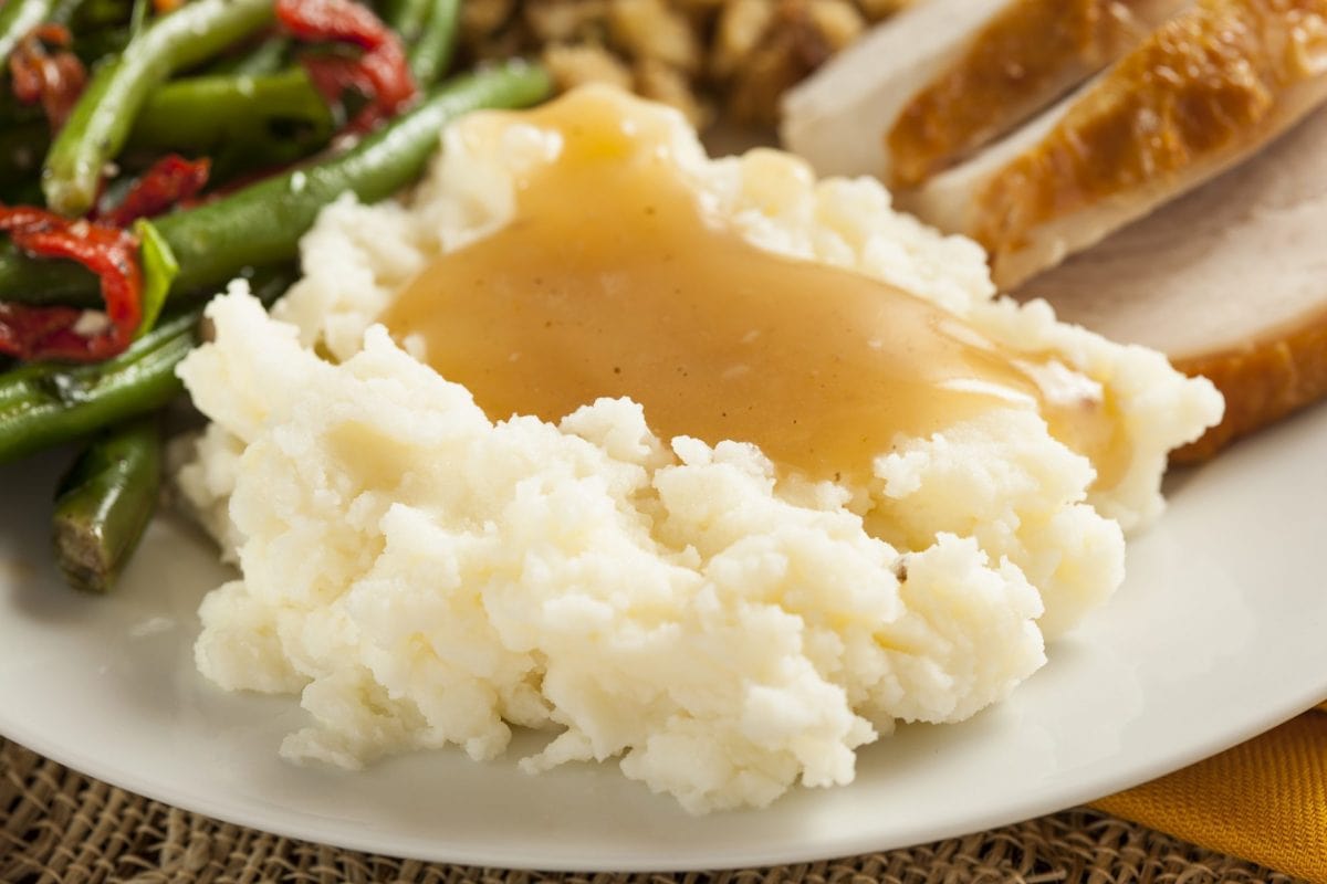 gravy from drippings over mashed potatoes  