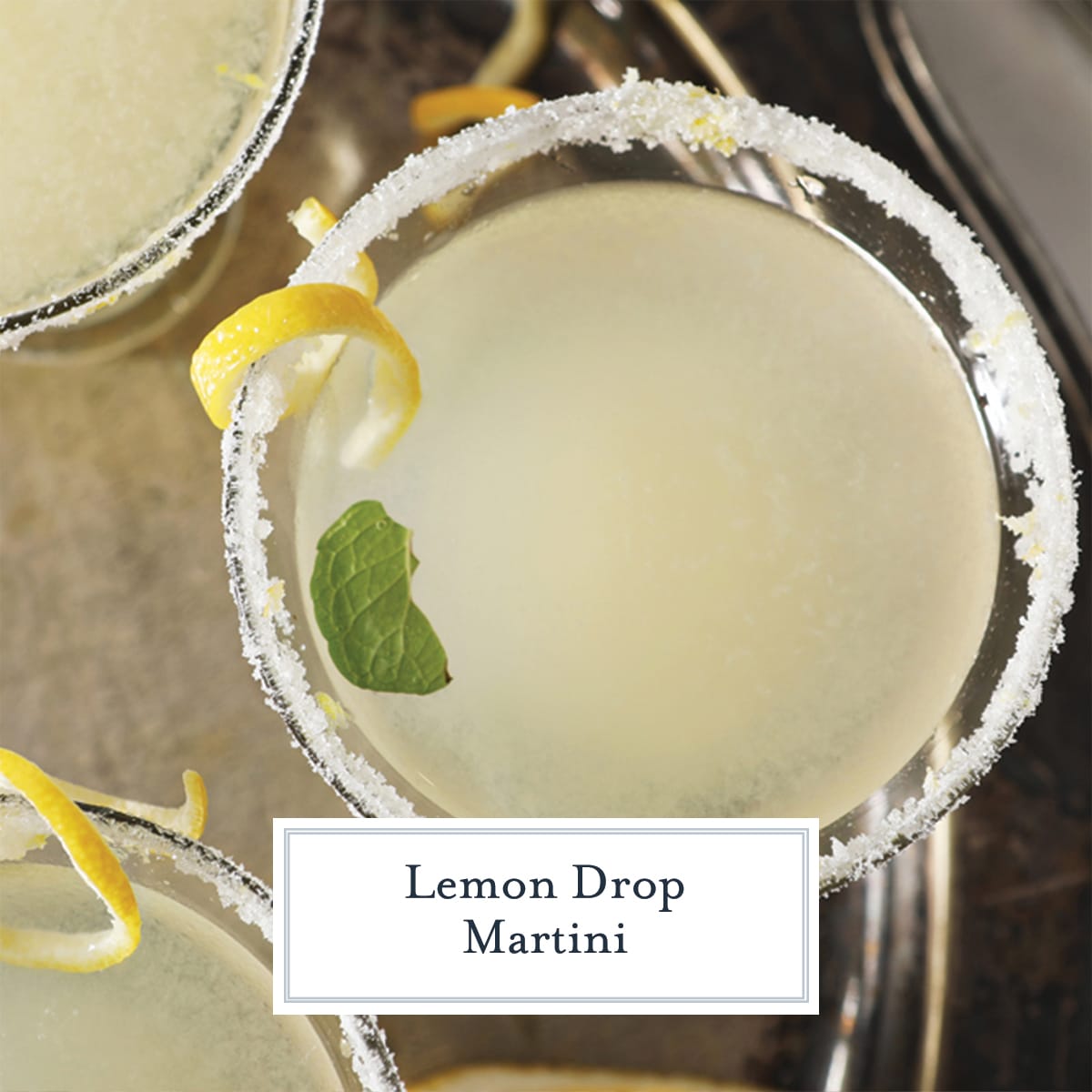 overhead close up of rimmed lemon drop martini with lemon twist 