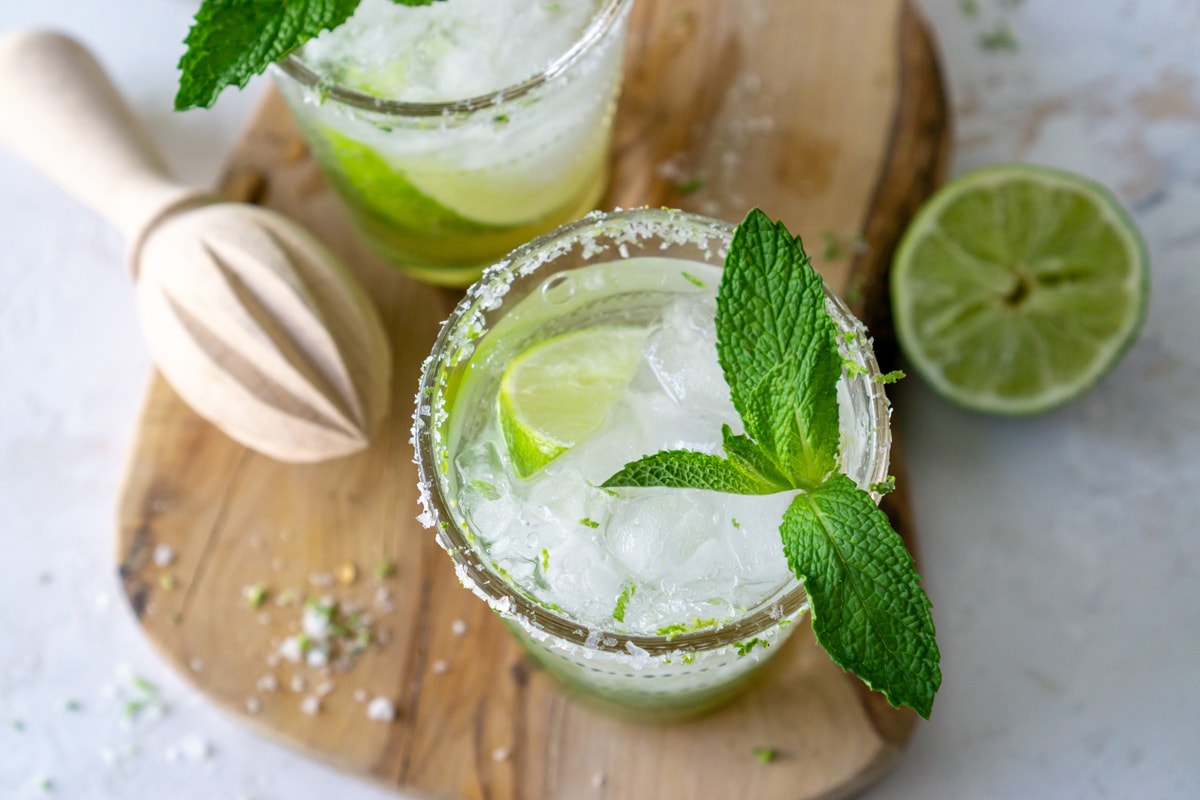 overhead of mint mojito garnished with lime and mint 