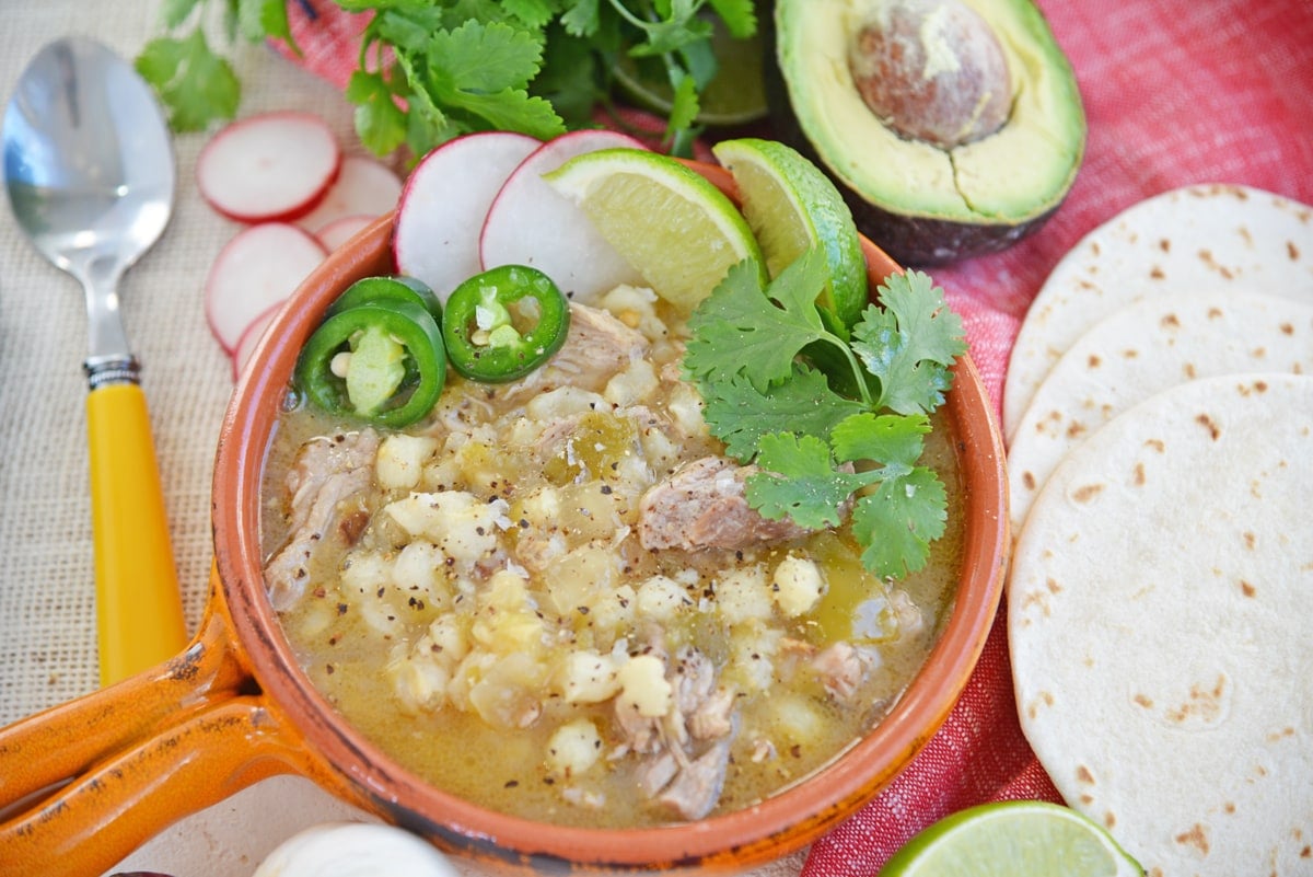 pozole with jalapeno, cilantro, lime and radish