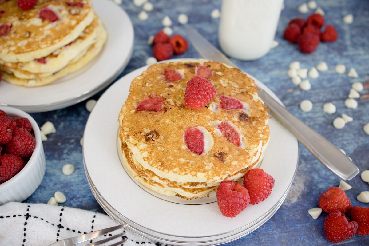 stack of raspberry pancakes without syrup 