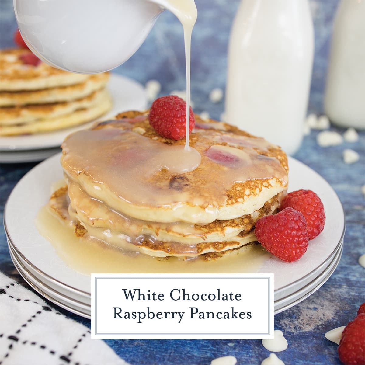 syrup pouring onto a stack of raspberry pancakes 