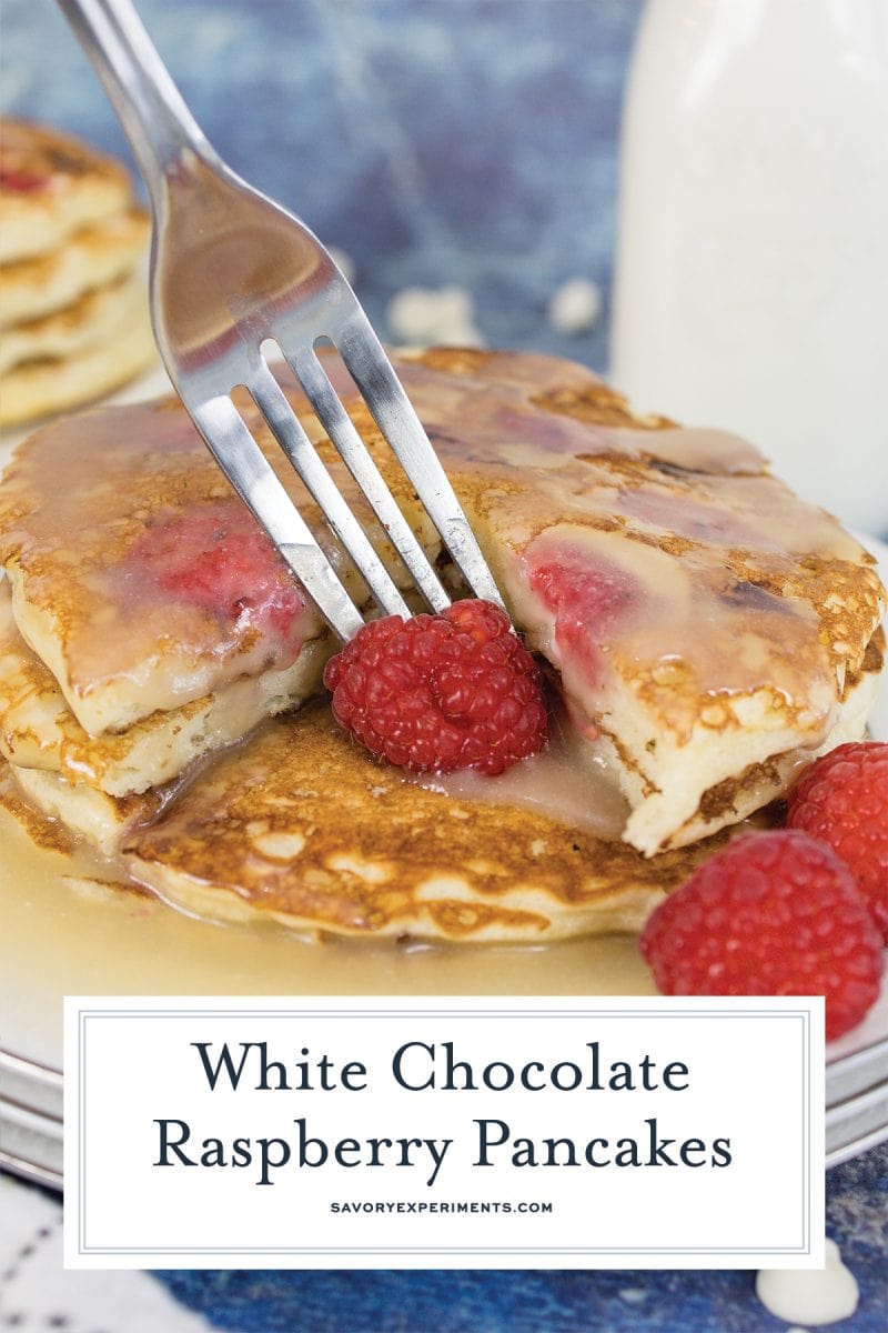 fork digging into raspberry pancakes 