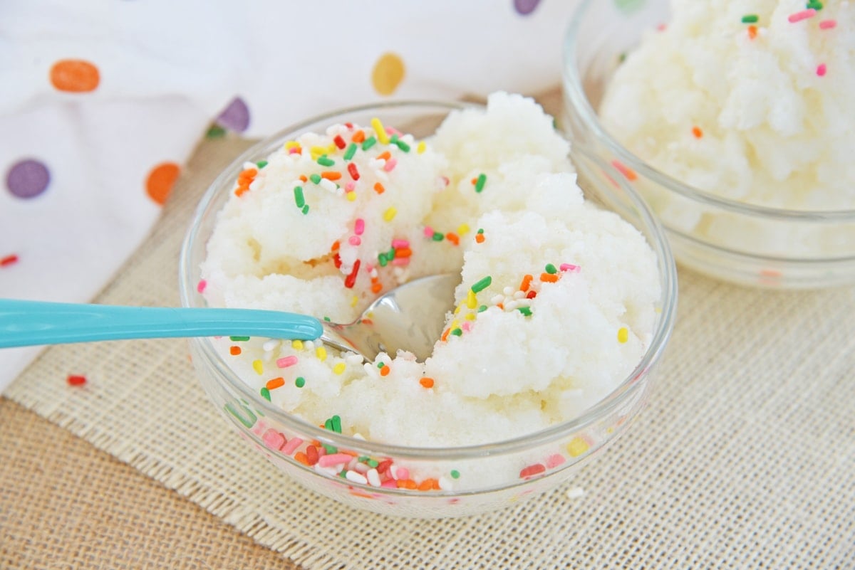 spoon digging into a bowl of snow cream 