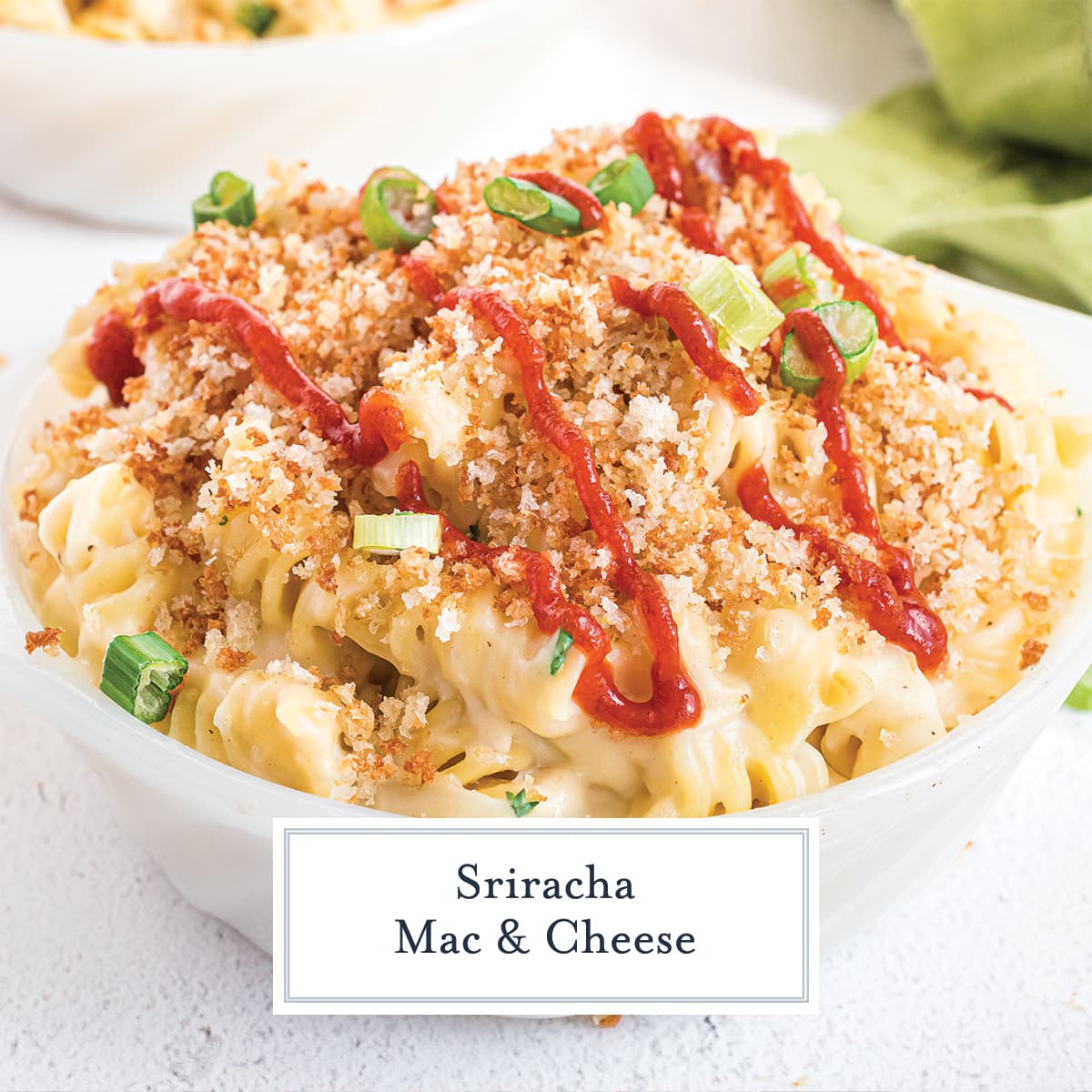 angle view of sriracha mac and cheese in a white bowl 