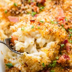 spoon digging into chicken ranch bacon mac and cheese