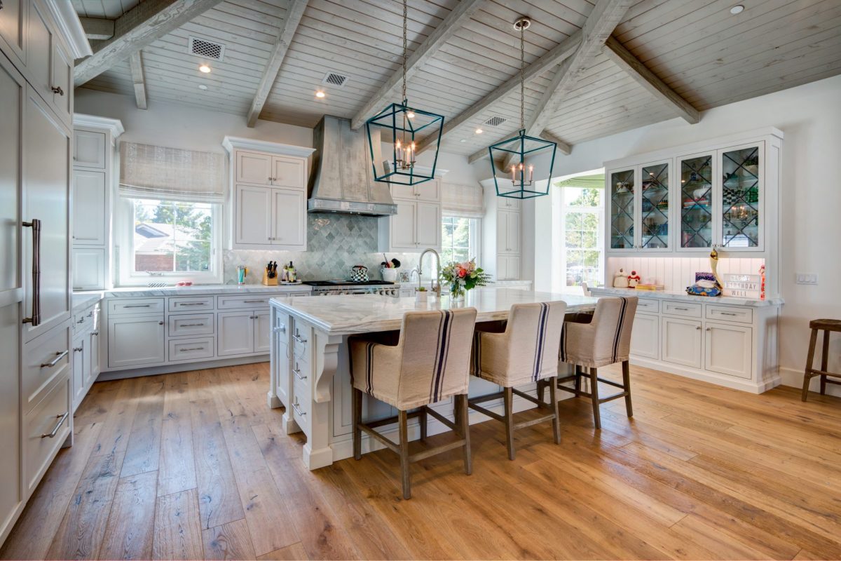 remodeled white kitchen with cathedral ceiling