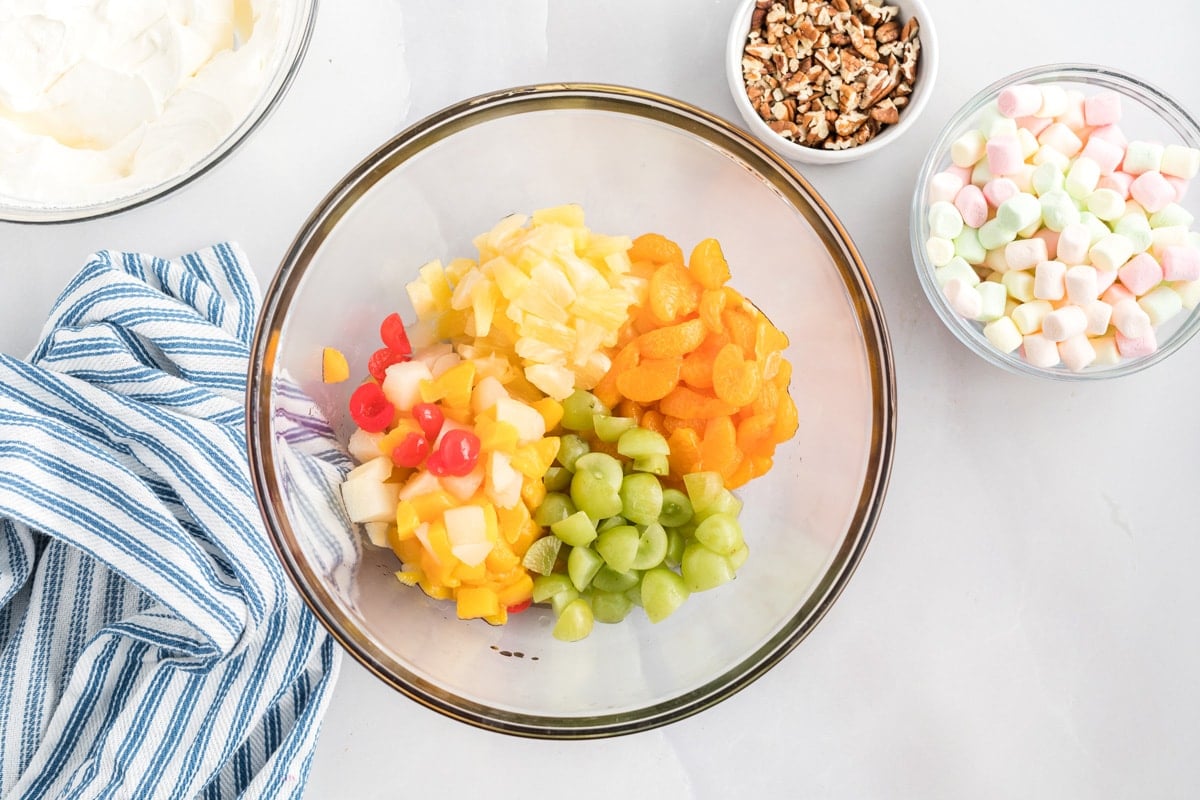 chopped fruits in a glass bowl 