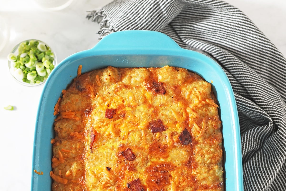 overhead of tater tot casserole in blue dish