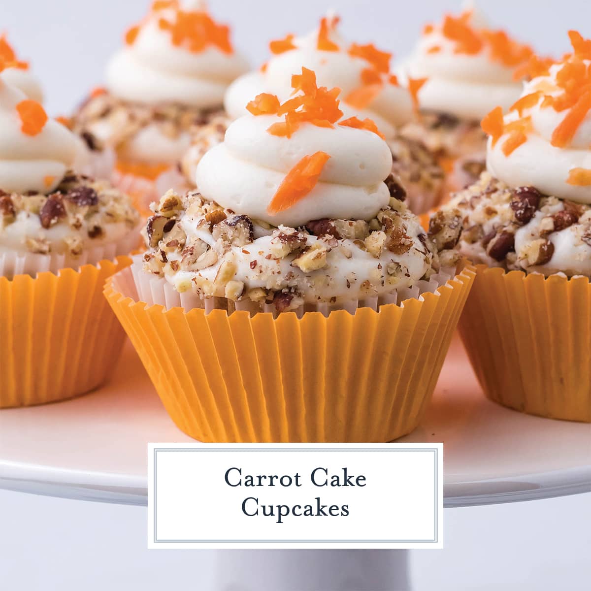 close up of carrot cake cupcakes with carrot topping