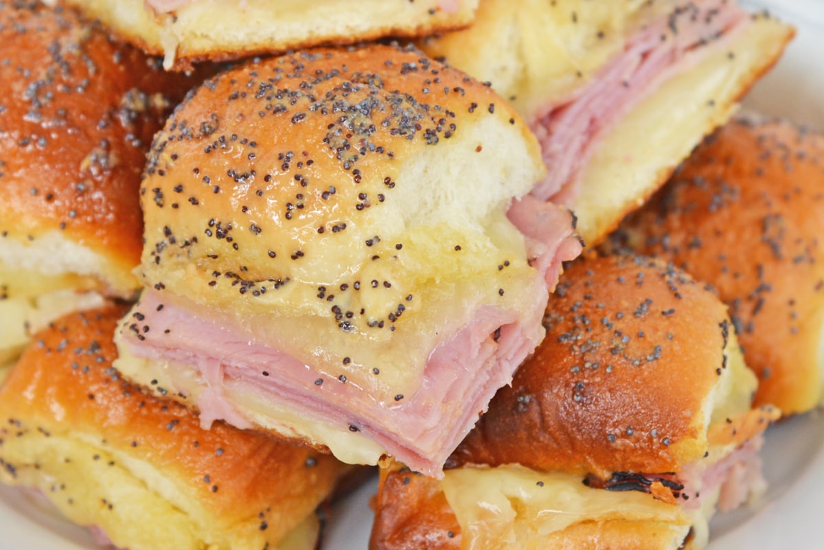 close up of buttery ham and cheese sandwich 