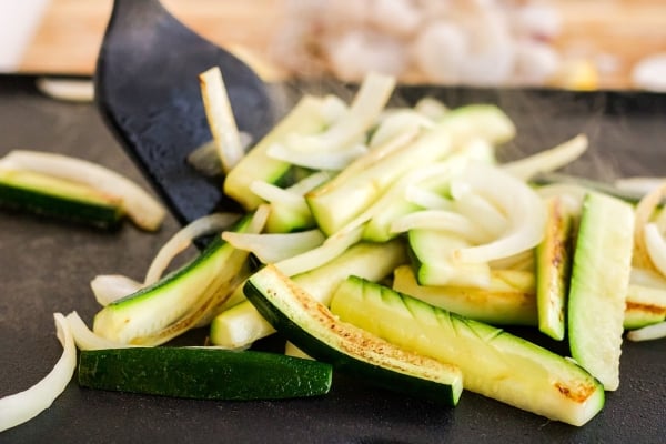 sauteing veggies on a griddle