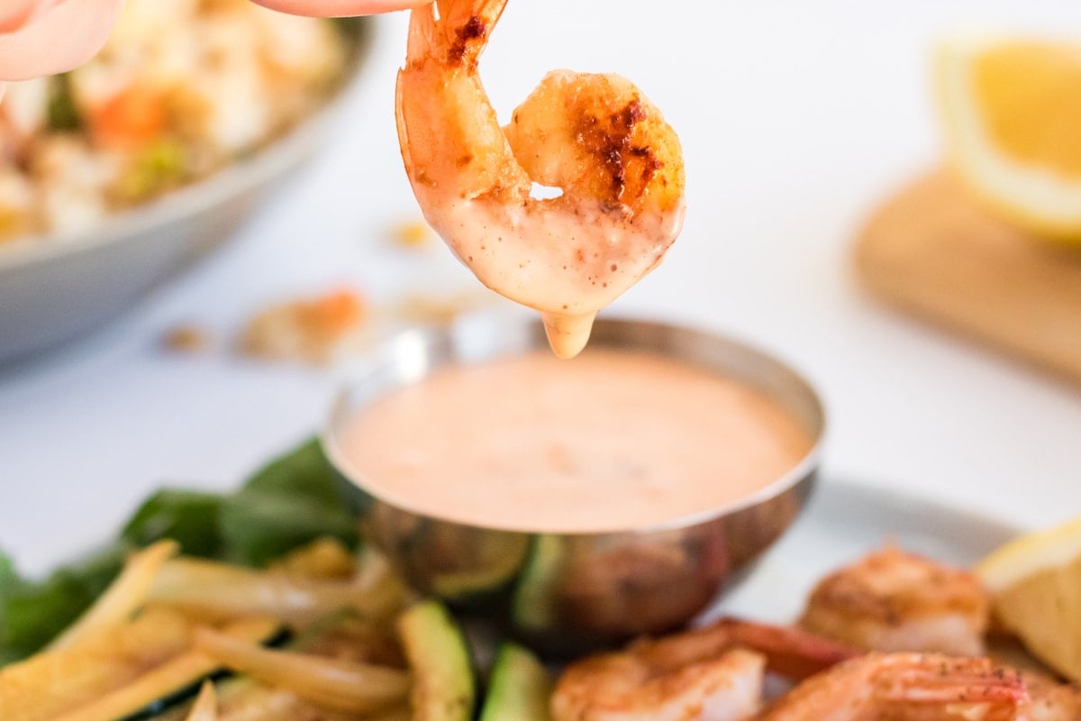 shrimp dipping into yum yum sauce 