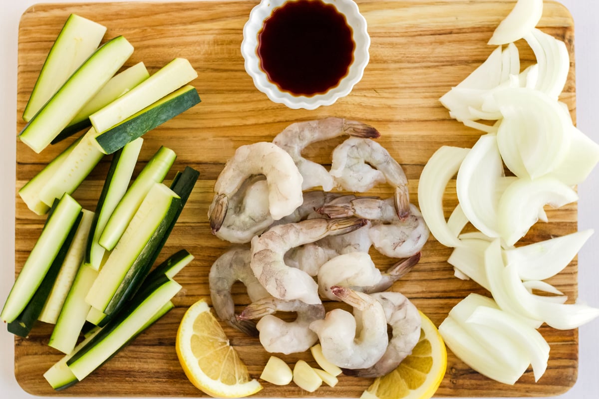 hibachi vegetables with sauce on a cutting board