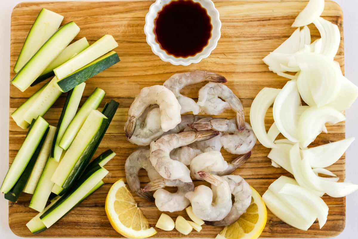 hibachi vegetables with sauce on a cutting board 