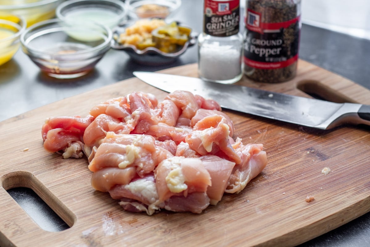 chopped chicken on a cutting board 