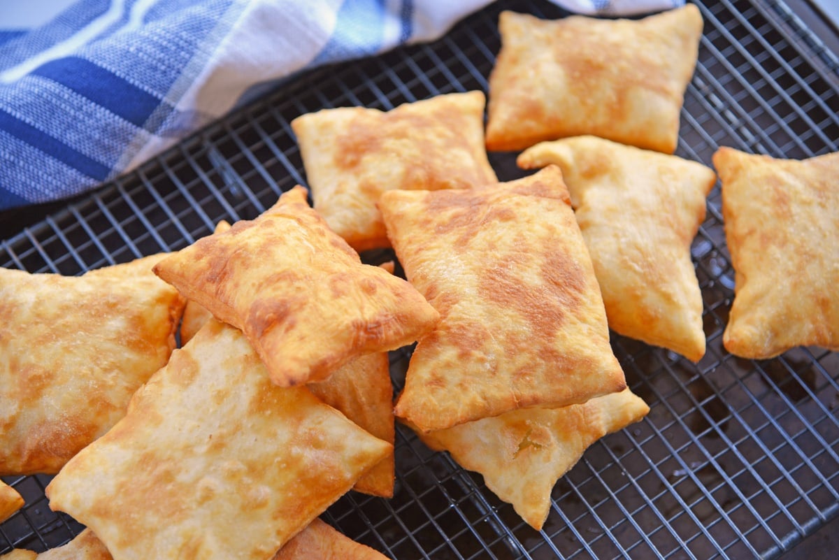 sopapillas on a wire rack  