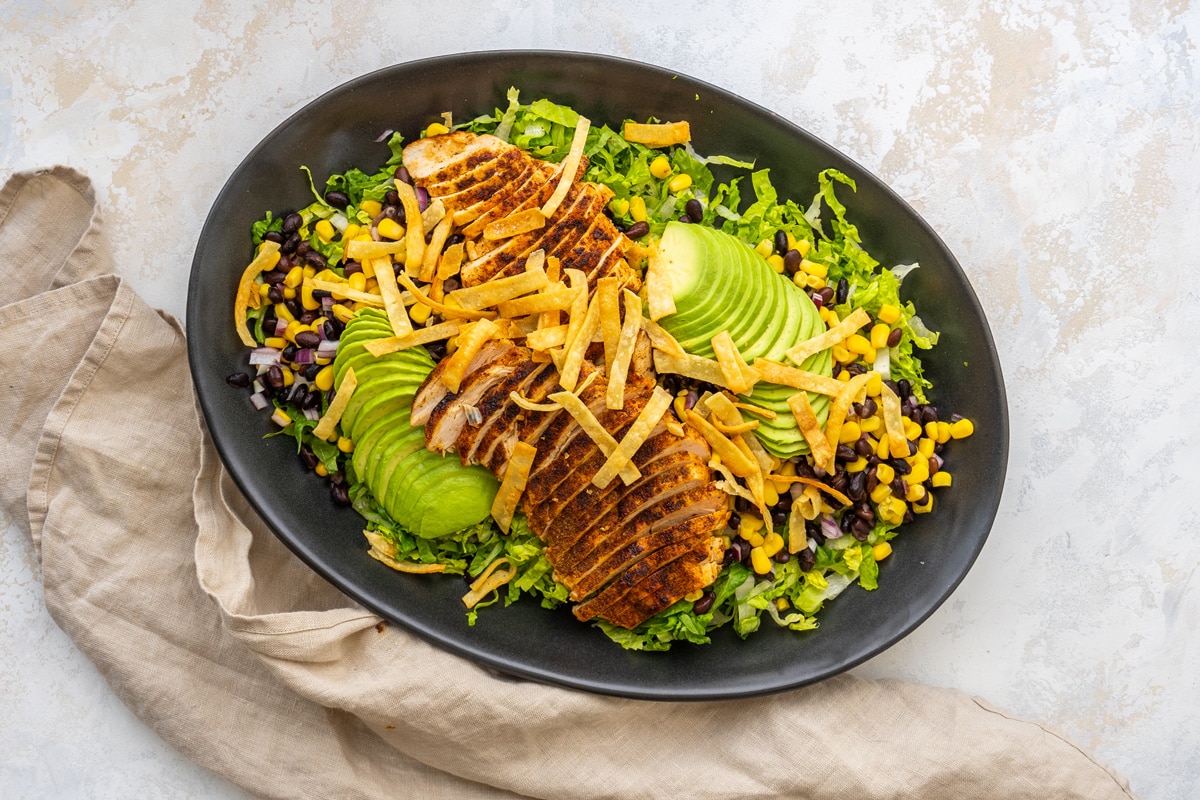 overhead of southwest chicken salad on an oval plate 