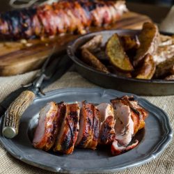 sliced bbq pork tenderloin on plate