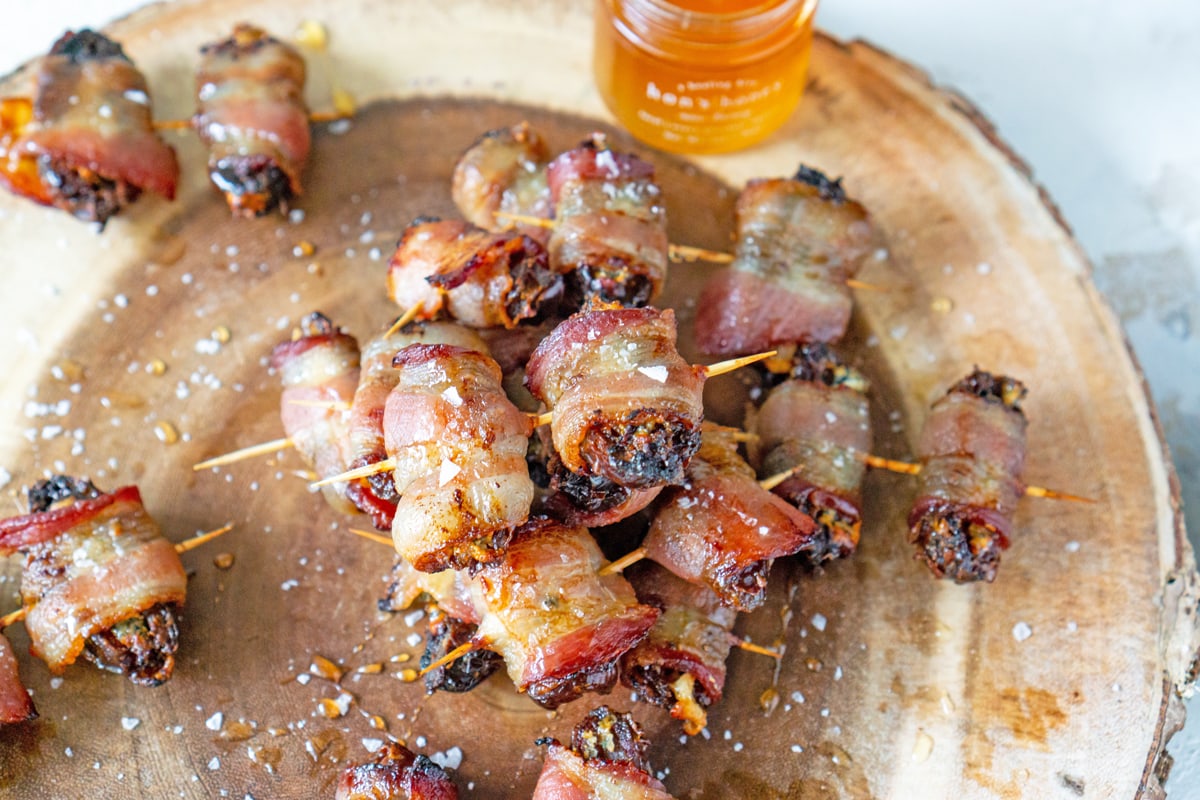 date appetizer on wood serving board