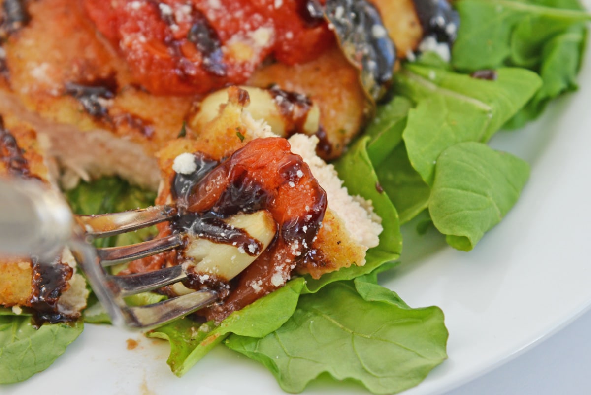 piece of chicken cutlet on a fork. 