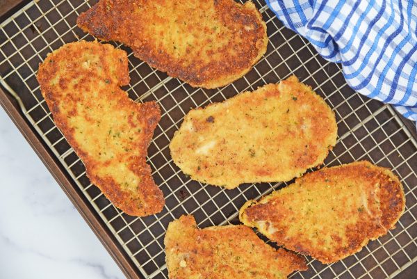 chicken cutlets on a wire rack