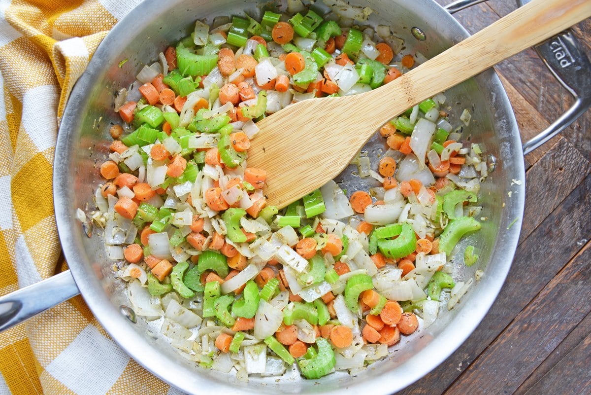 vegetables in a skillet with fresh herbs 