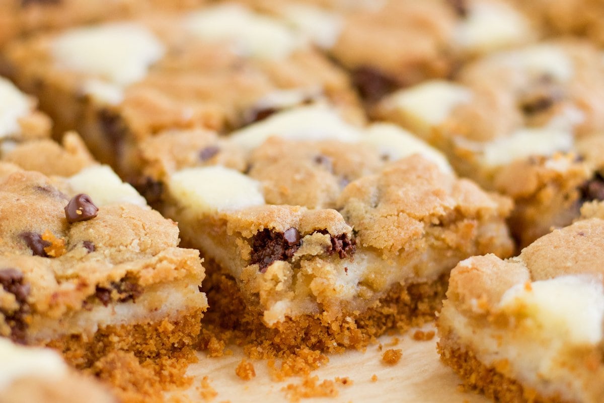 close up corner of chocolate chip cookie cheesecake bar 