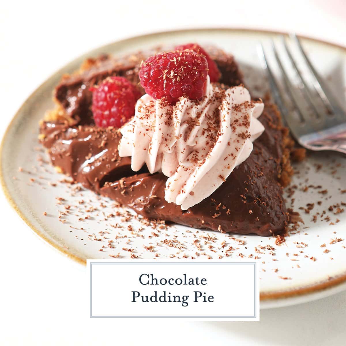 close up of a slice of chocolate pudding pie topped with whipped cream and raspberries 