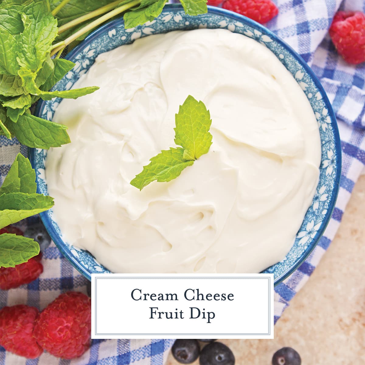 overhead shot of cream cheese fruit dip in blue bowl with text overlay for facebook