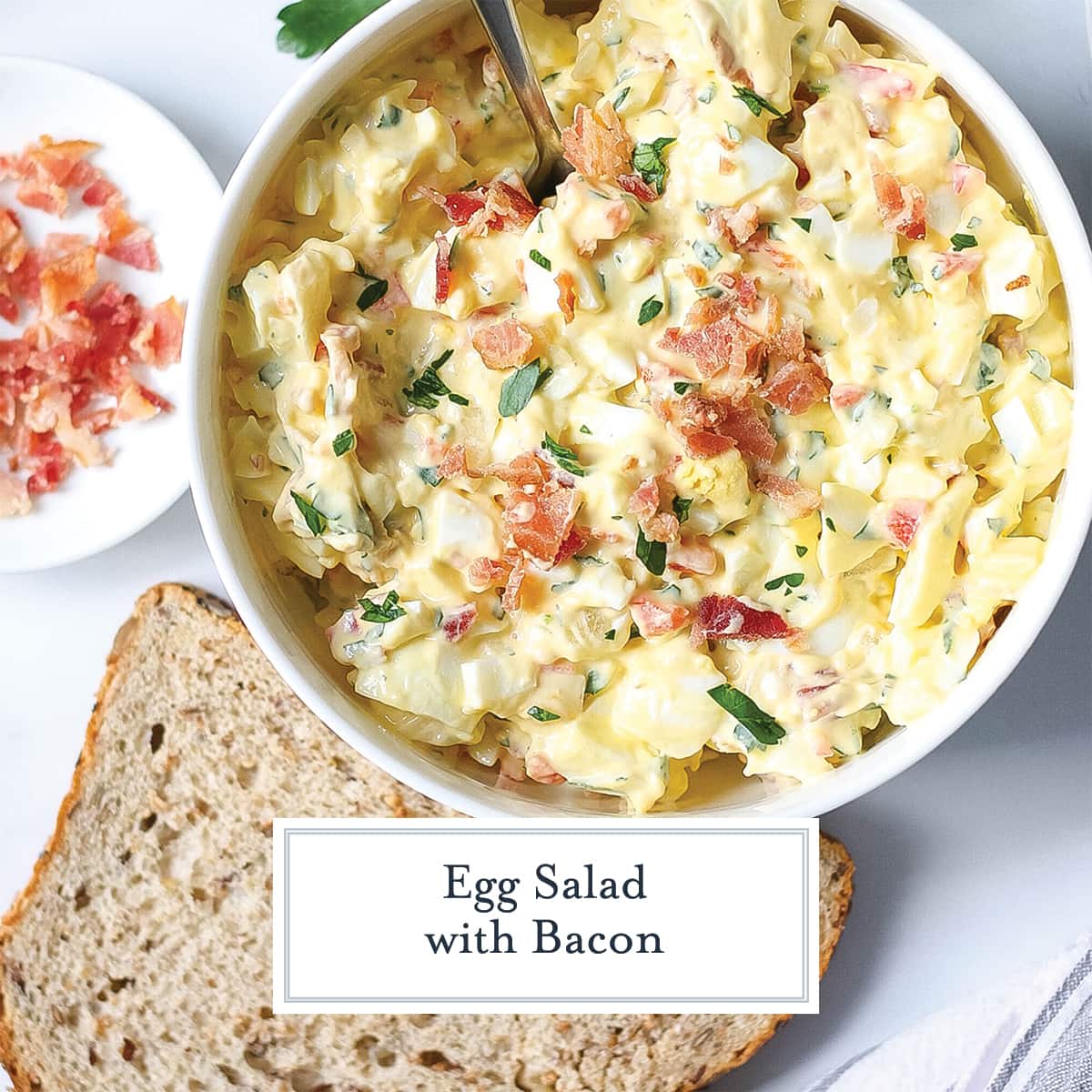 egg salad with a slice of bread and crumbled bacon