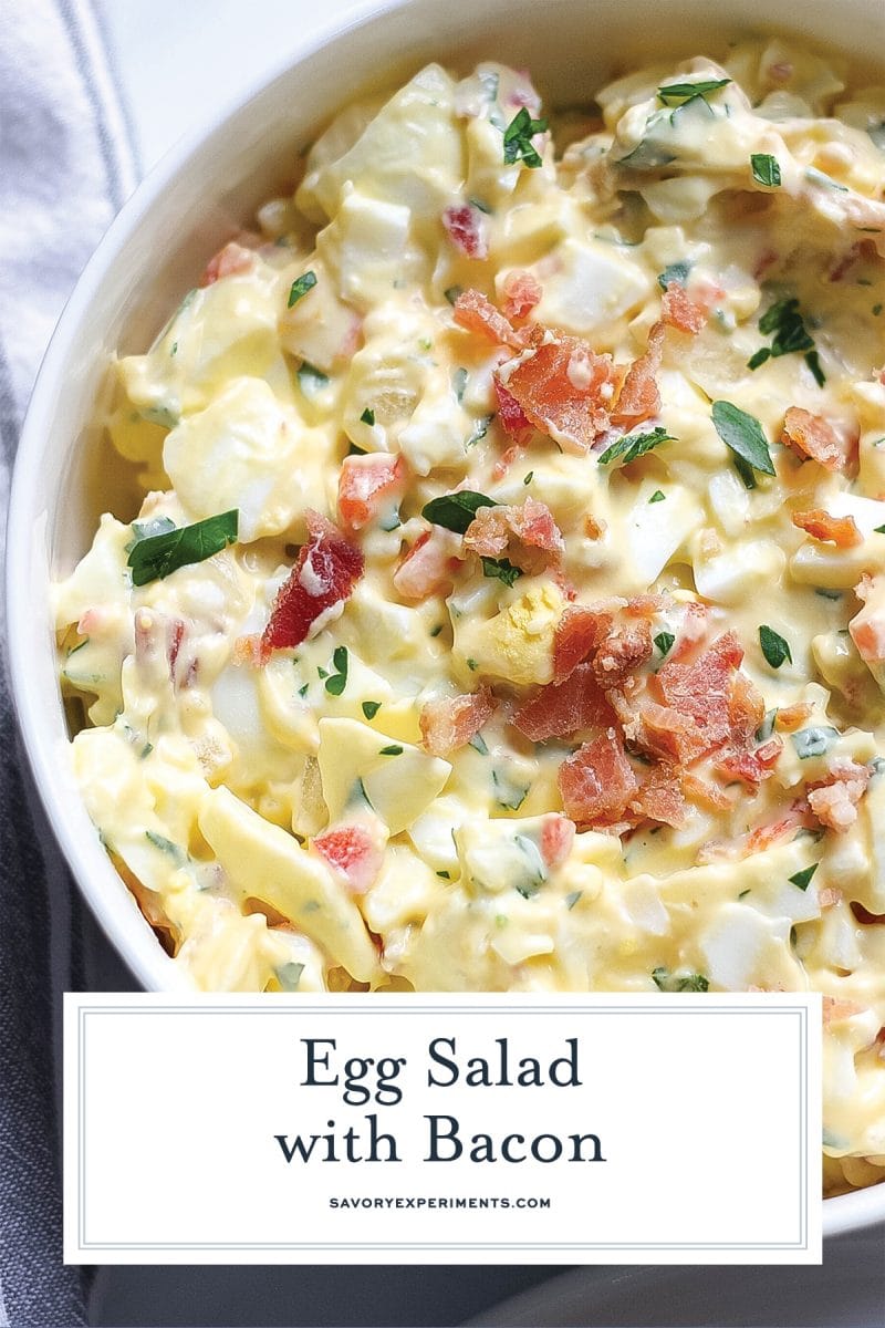 close up of egg salad with bacon in a white bowl  