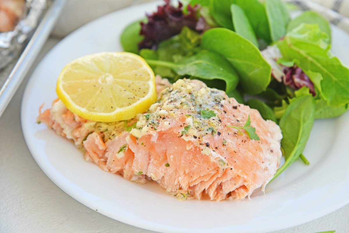slice of garlic salmon on a serving plate 