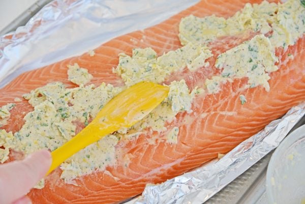 slathering salmon with butter