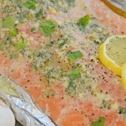 close up of garlic butter baked salmon in foil