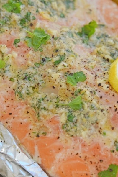close up of garlic butter baked salmon in foil