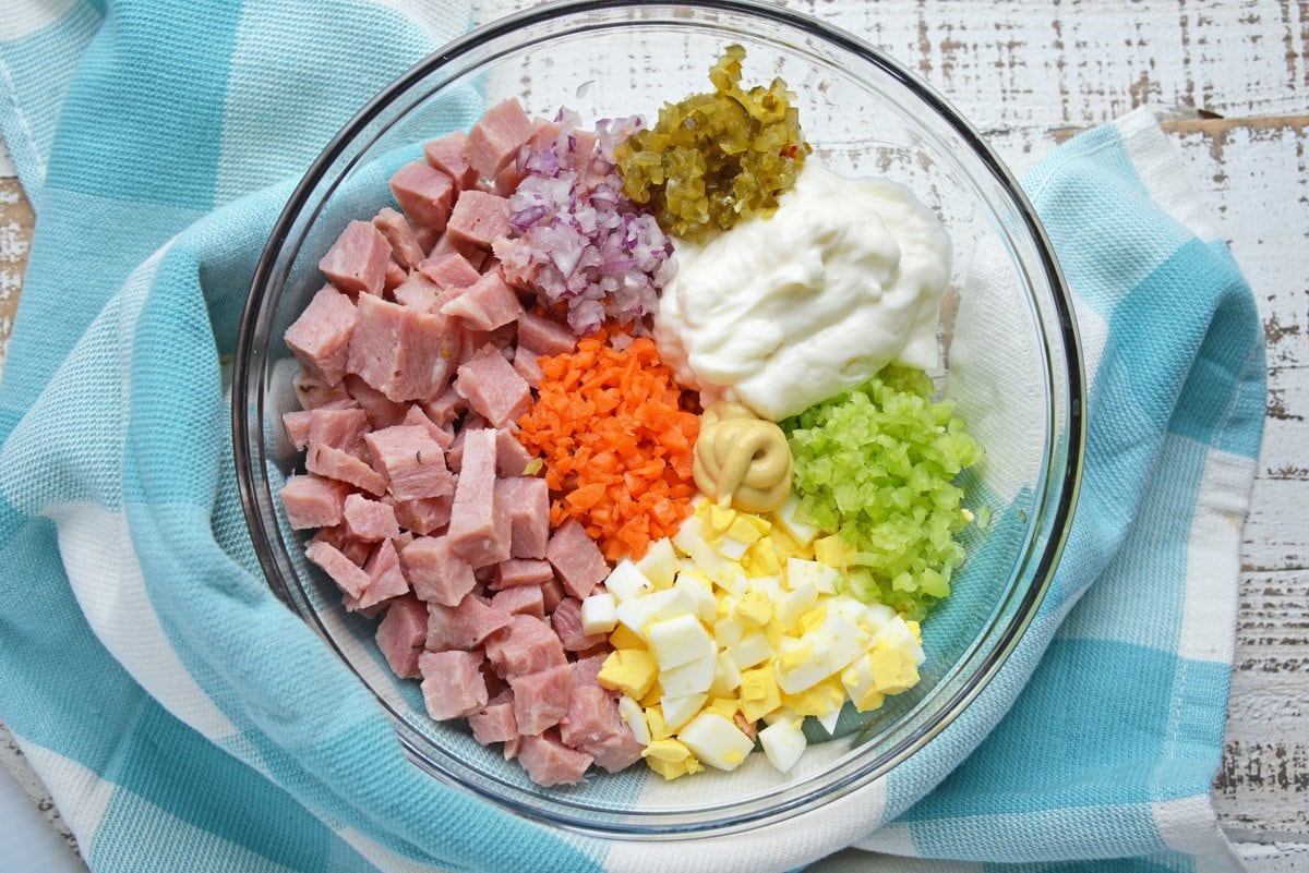 ingredients for ham salad recipe in a glass mixing bowl 