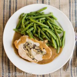 slice of pork roast with green beans